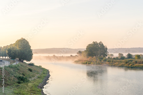Fog over border river Oder in the morning. Oder is river between Poland and German.