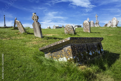 Clonmacnoise Cathedral  with the typical crosses and graves photo