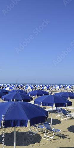 Beach with beach umbrellas in Versilia. Viareggio, Tuscany, Italy