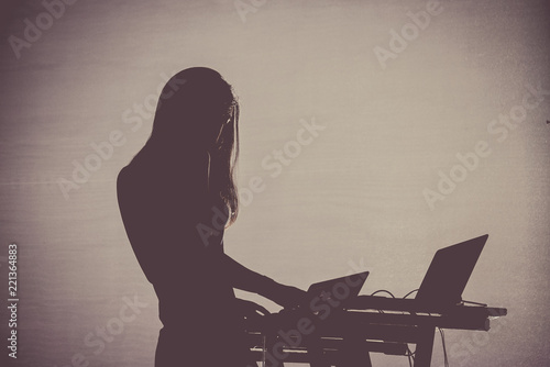 Silhouette of an unregnizable female deejay photo