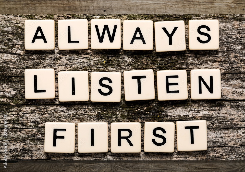 Always Listen First sign with wooden cubes