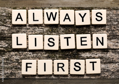 Always Listen First sign with wooden cubes
