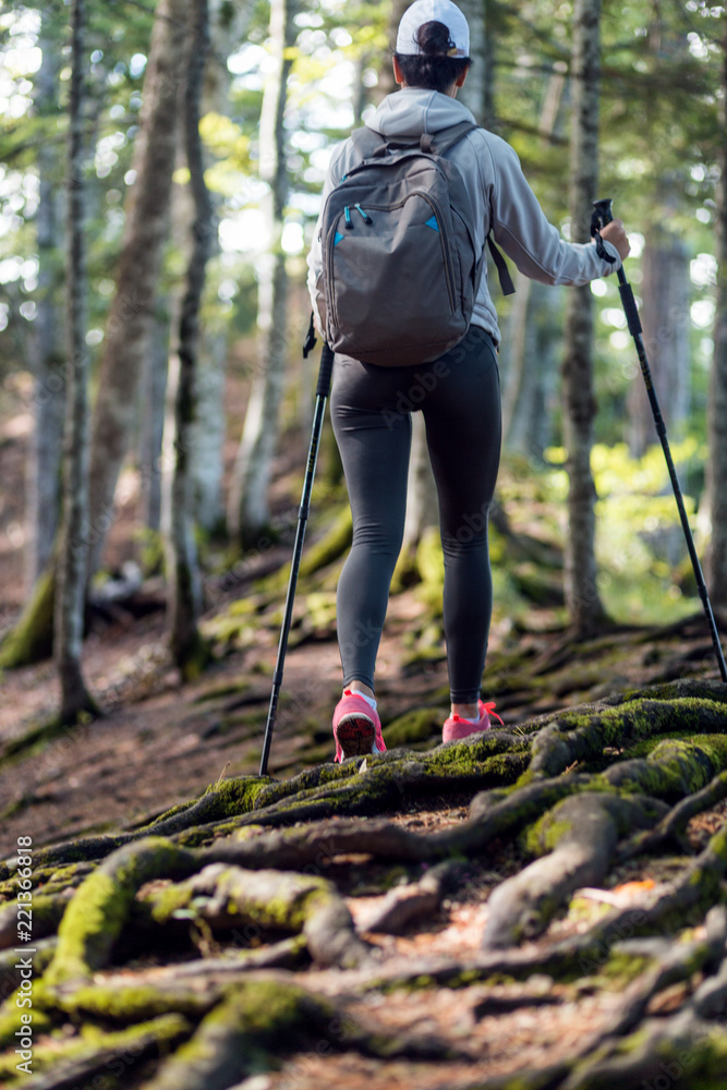 © Novak - Active female hiker walking and exploring forest © Novak - Active female hiker walking and exploring forest