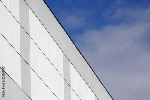 The facade of the building on the background of blue sky