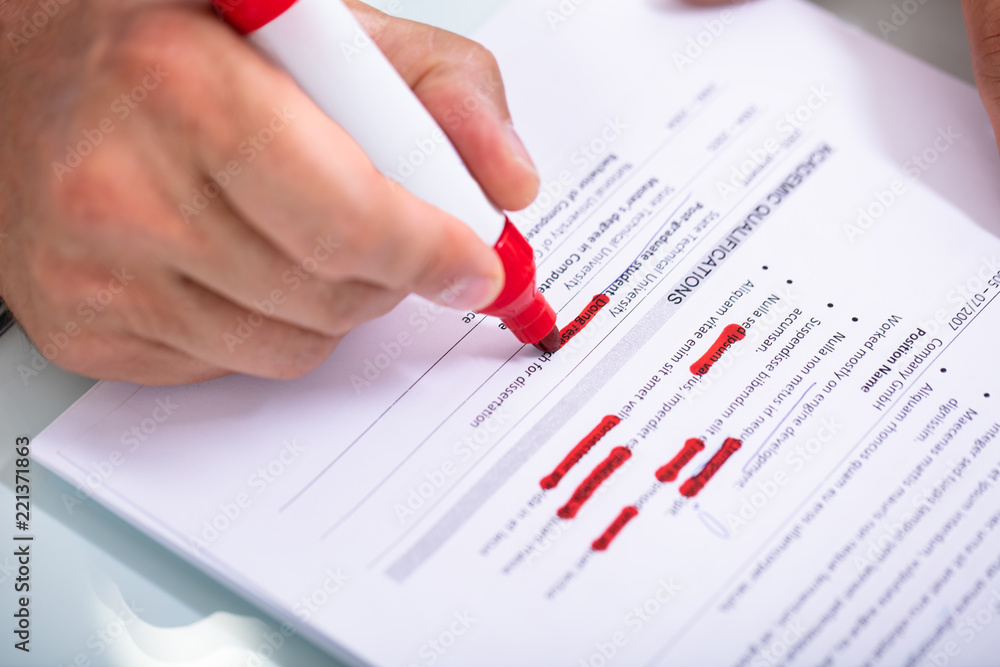 Businessperson Holding Marker On Document Businessperson Holding Marker On Document