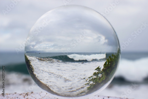 Large Wave at Beach Taken Through Glass or Crystal Ball