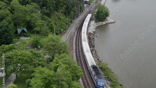 Flying Over Passing Train by the Hudson River photo