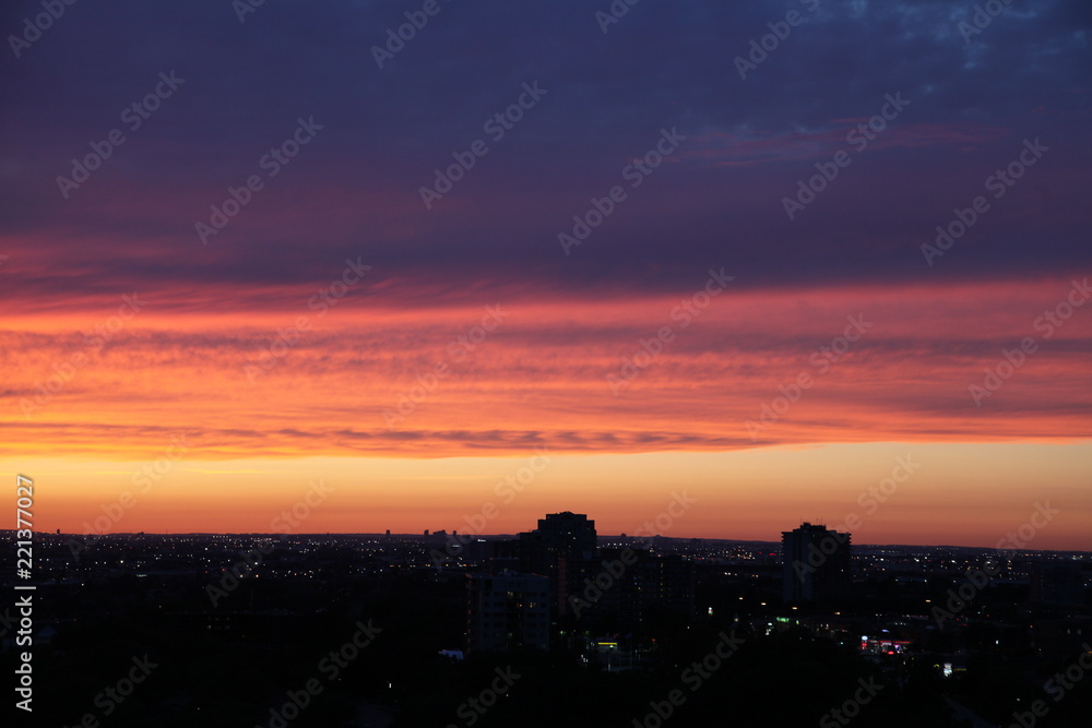 Purple sky during sunset on city