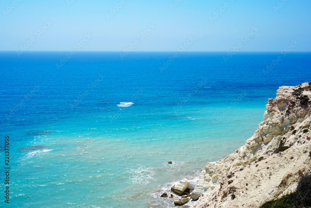 Beautiful seascape with bright clear sky and blue sea in sunny summer day not far from the city of Paphos in Cyprus
