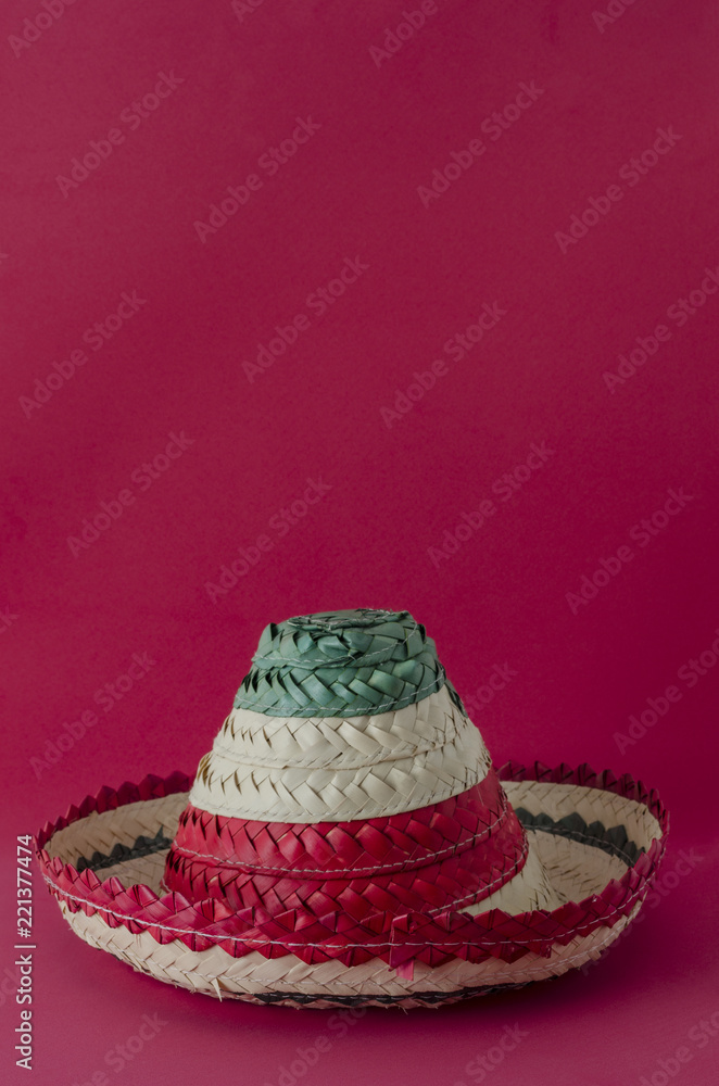 Little hat with mexican flag colors against red background. Little hat for mexican Independence Day celebration Little hat with mexican flag colors against red background. Little hat for mexican Independence Day celebration