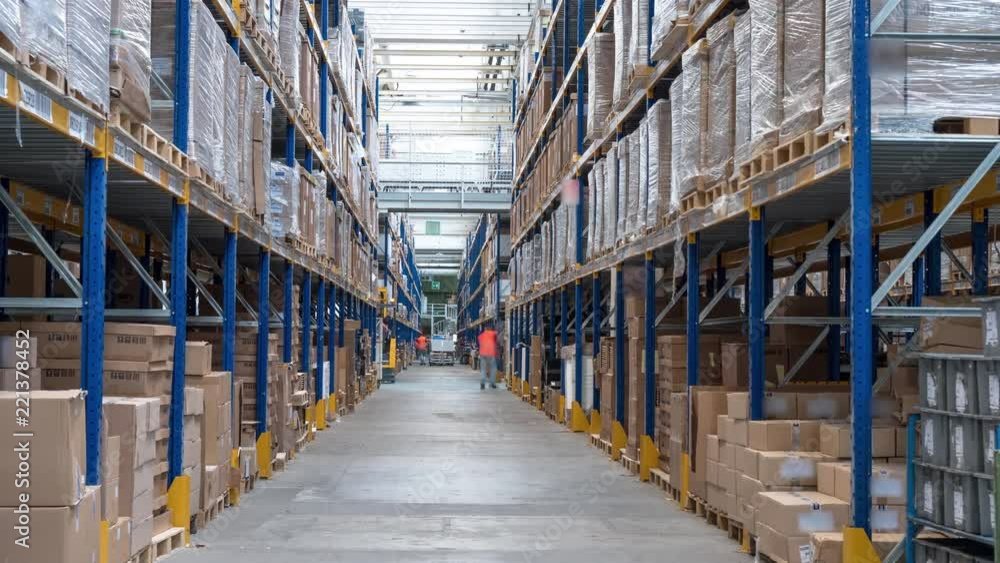 Time-lapse clip of busy workers in a warehouse or factory Time-lapse clip of busy workers in a warehouse or factory