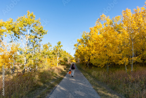 Mother and son walking along a footpath in Autumn