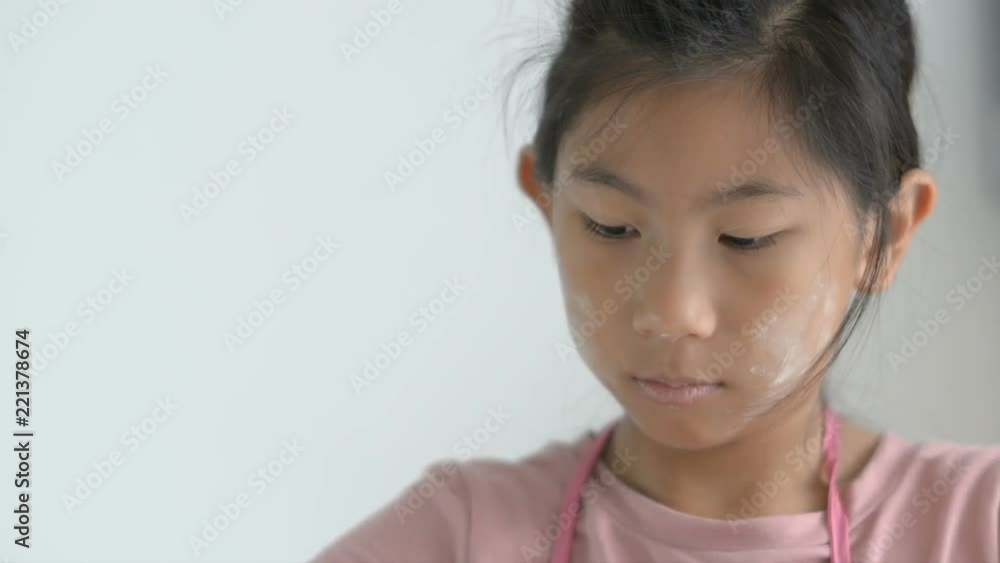 Asian girl making pork wonton at home, putting pork on dough sheep, lifestyle concept. Asian girl making pork wonton at home, putting pork on dough sheep, lifestyle concept.
