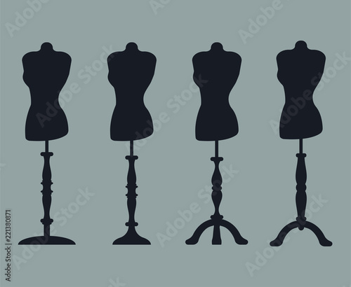 Set of 4 silhouettes of mannequins on carved legs.