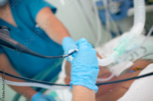 Medical background with endoscopy to the patient, unfocused background
