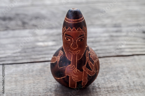 Foto Carved gourd in the likeness of a flute player - Ecuador