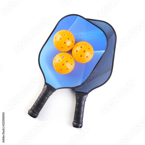 Pickleball paddle and balls on white