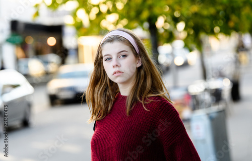 Young girl student with urban background photo