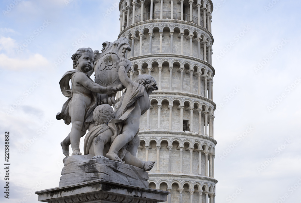 the beautiful fountain of the putti with the background of the tower of Pisa.
