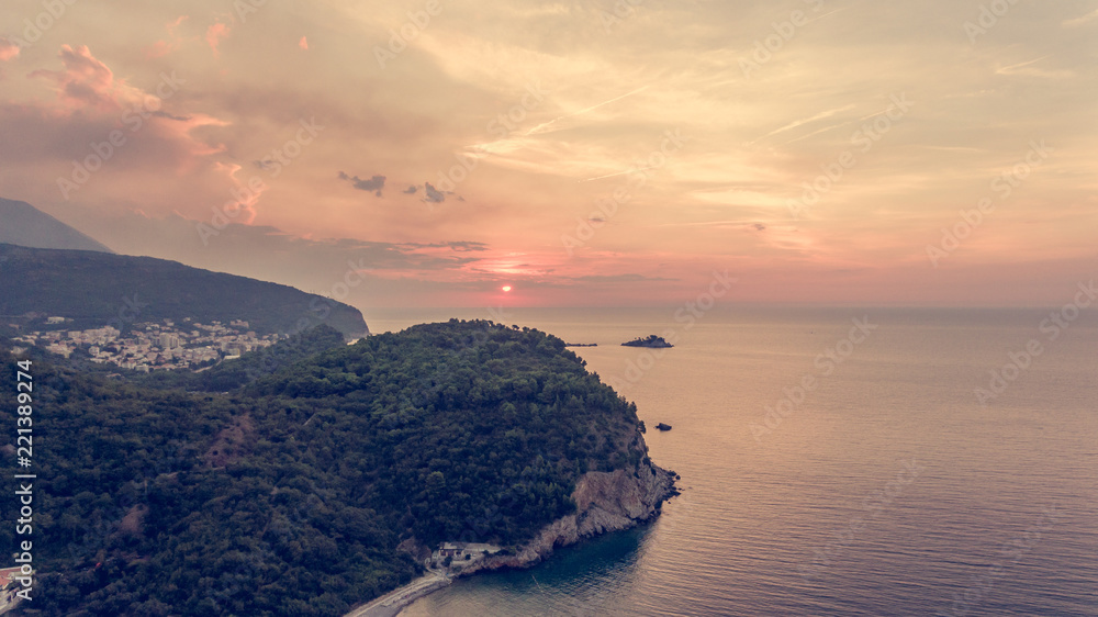 Spectacular aerial view of coastline at sunset.