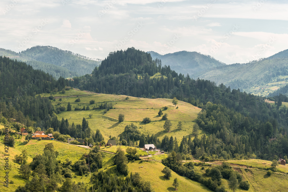 Landscape view on mountains, hills and meadow in village in Tara national par in Serbia - obrazy, fototapety, plakaty 