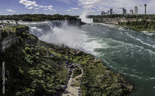 panorama of tourist standing in queue to touch and witness Niagara Falls