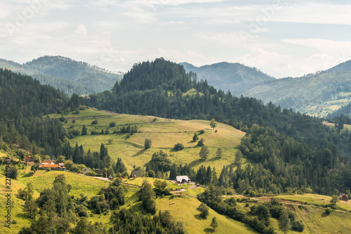 Landscape view on mountains, hills and meadow in village in Tara national par in Serbia photo
