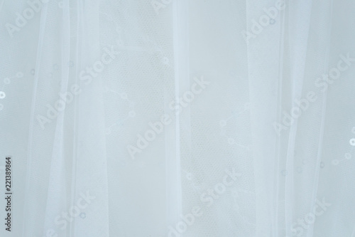 Close-up of white wedding dress