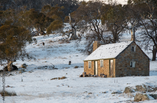 Small Australian cabin covered in snow