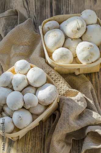 Fresh champignon mushrooms in a basket