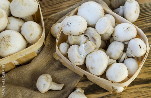 Fresh champignon mushrooms in a basket