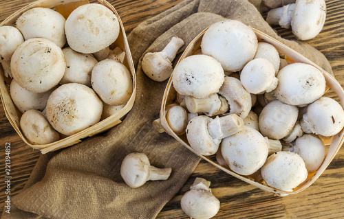 Fresh champignon mushrooms in a basket