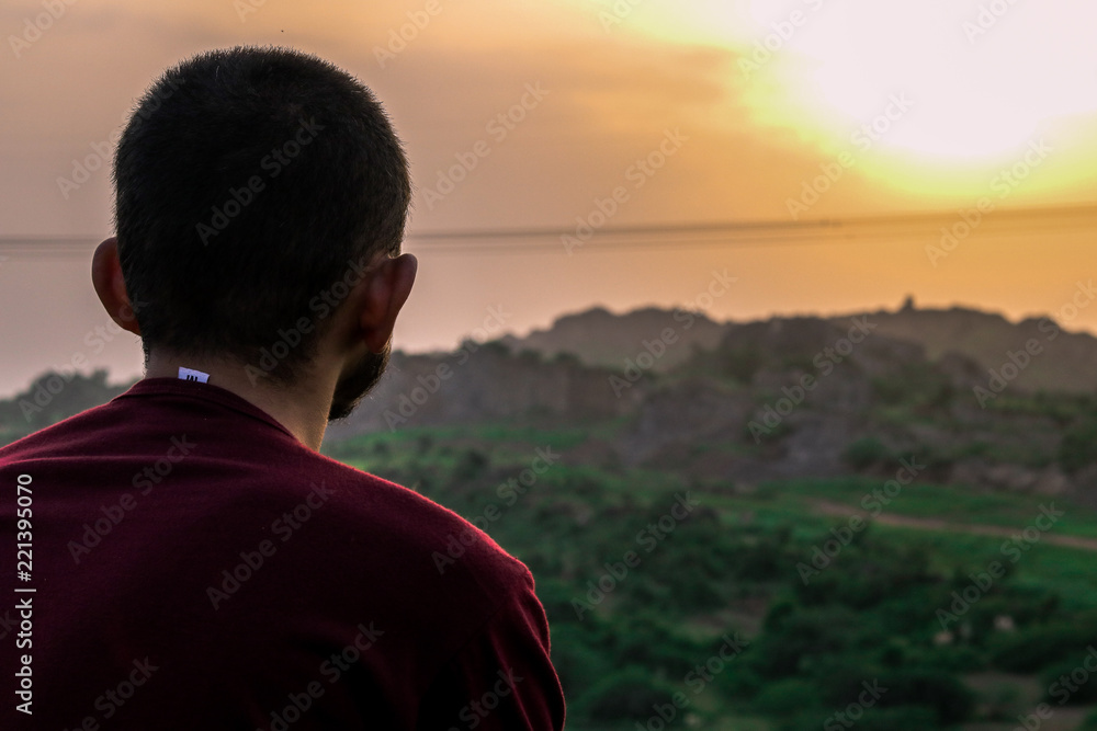 silhouette of man on top of mountain silhouette of man on top of mountain