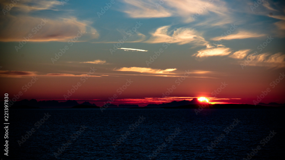 Sunset and sunrise over the sea and Lofoten archipelago from the Moskenes - Bodo ferry, Norway