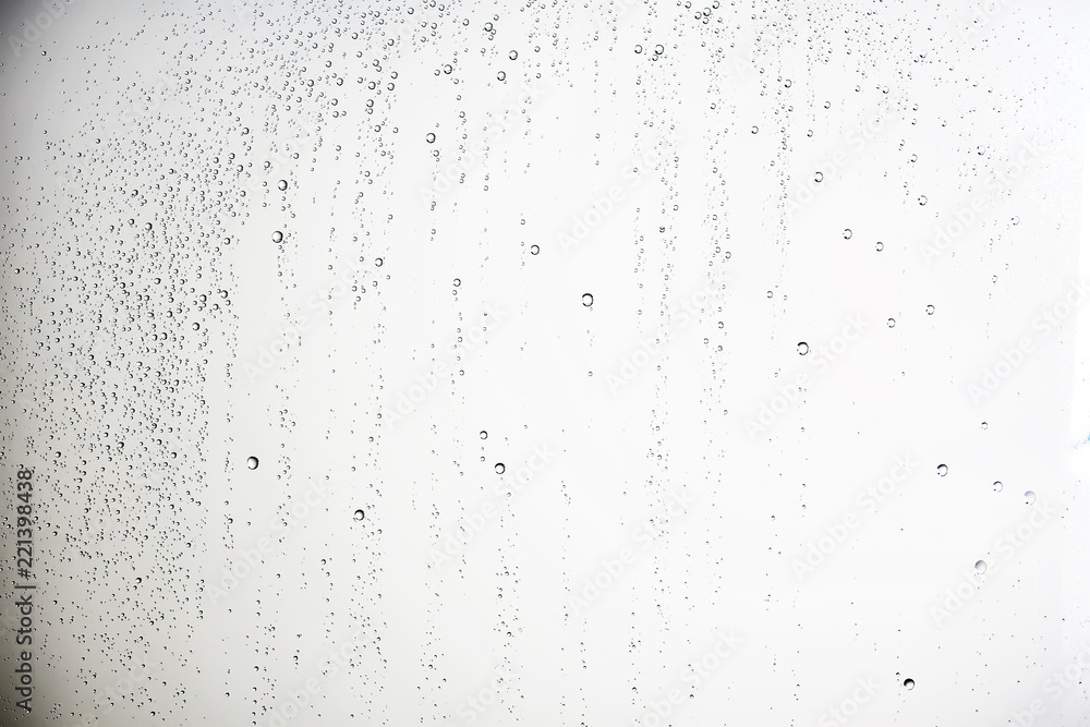 white isolated background water drops on the glass / wet window glass with splashes and drops of water and lime, texture autumn background white isolated background water drops on the glass / wet window glass with splashes and drops of water and lime, texture autumn background