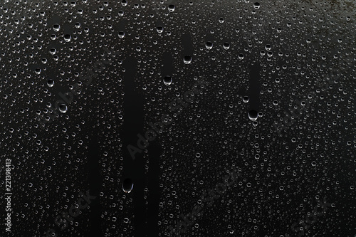 black wet background / raindrops for overlaying on window, concept of autumn weather, background of drops of water rain on glass transparent