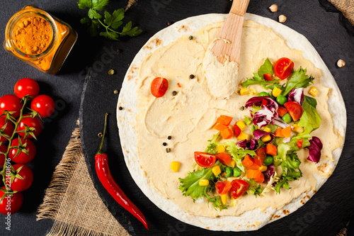 Tortilla with vegetables and hummus with chickpeas