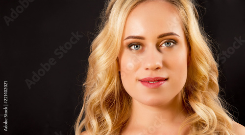 blond girl on a black background