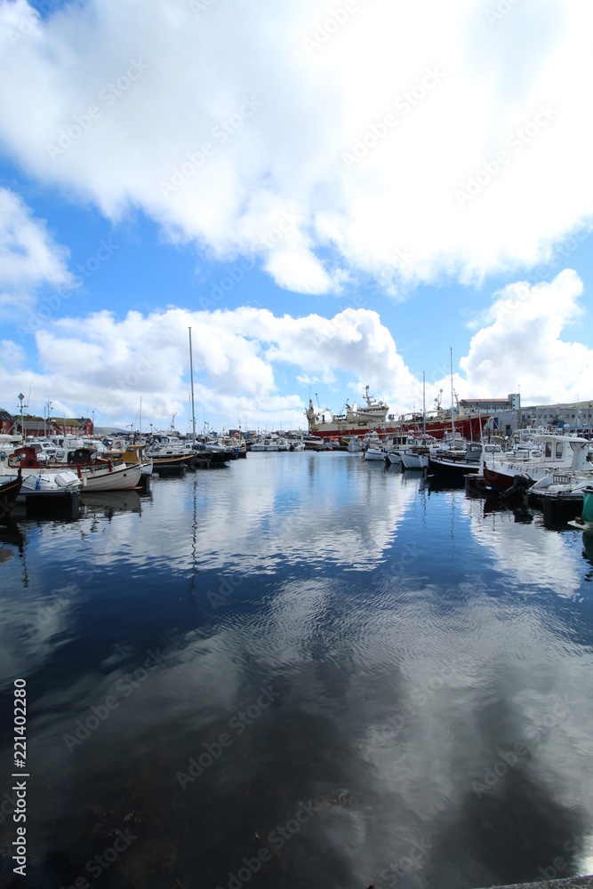 Torshavn harbour with cloud reflections in the water