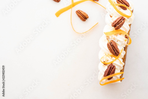 Vegan, raw carrot cake. Healthy food. White stone background. Top view. Copy space.