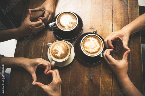 Latte coffee art and people meeting friendship togetherness and show hand with love in coffee shop, Friends meeting happiness coffee shop concept