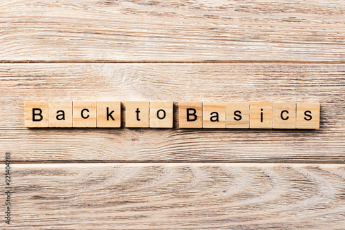 back to basics word written on wood block. back to basics text on table, concept