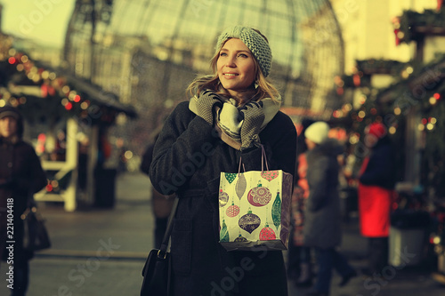 happy woman buys gifts for the new year