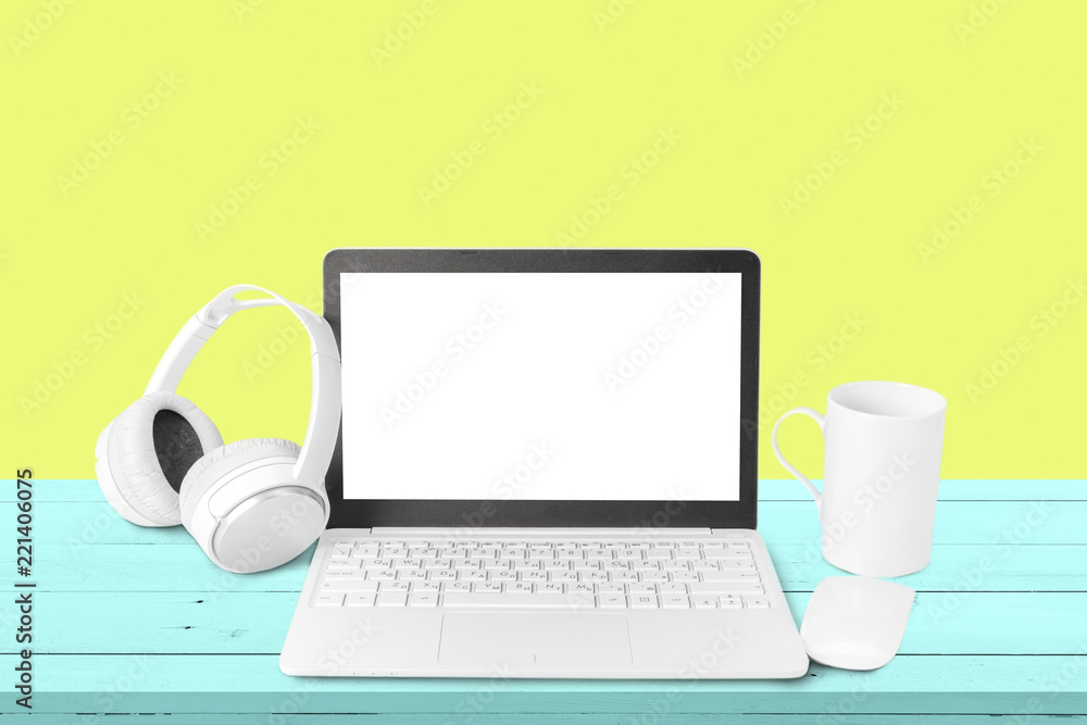 Fototapeta premium New headphones and laptop on the table