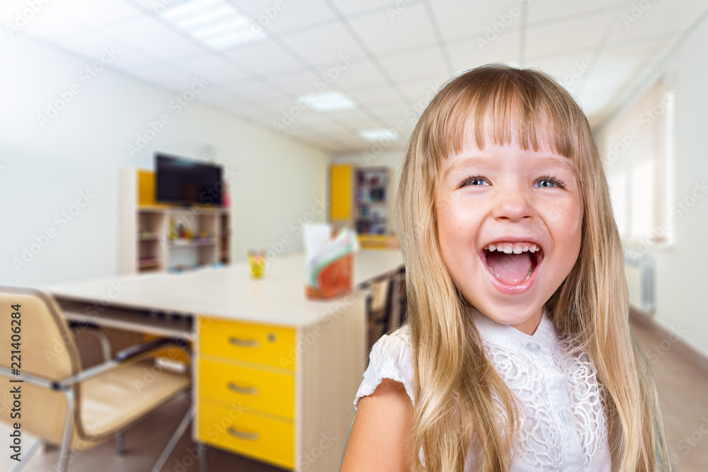 Portrait of a little school girl in a class Portrait of a little school girl in a class