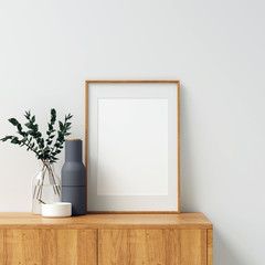 Vertical Poster Frame Mockup on Wooden Cabinet in Minimal Scandinavian Interior