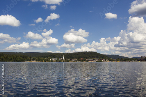Heap clouds in the blue sky over the Titisee in the Black Forest © were