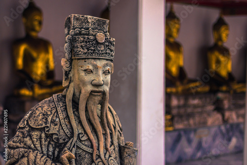 Bangkok - October 13, 2014: Statue of an ancient wiseman in the Buddhist Wat Pho temple in central Bangkok, Thailand