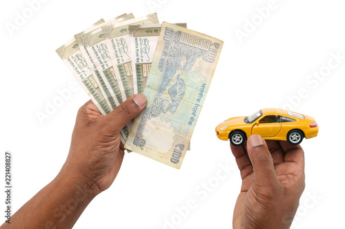 indian currency notes and toy car in the hands bank loan concept  photo