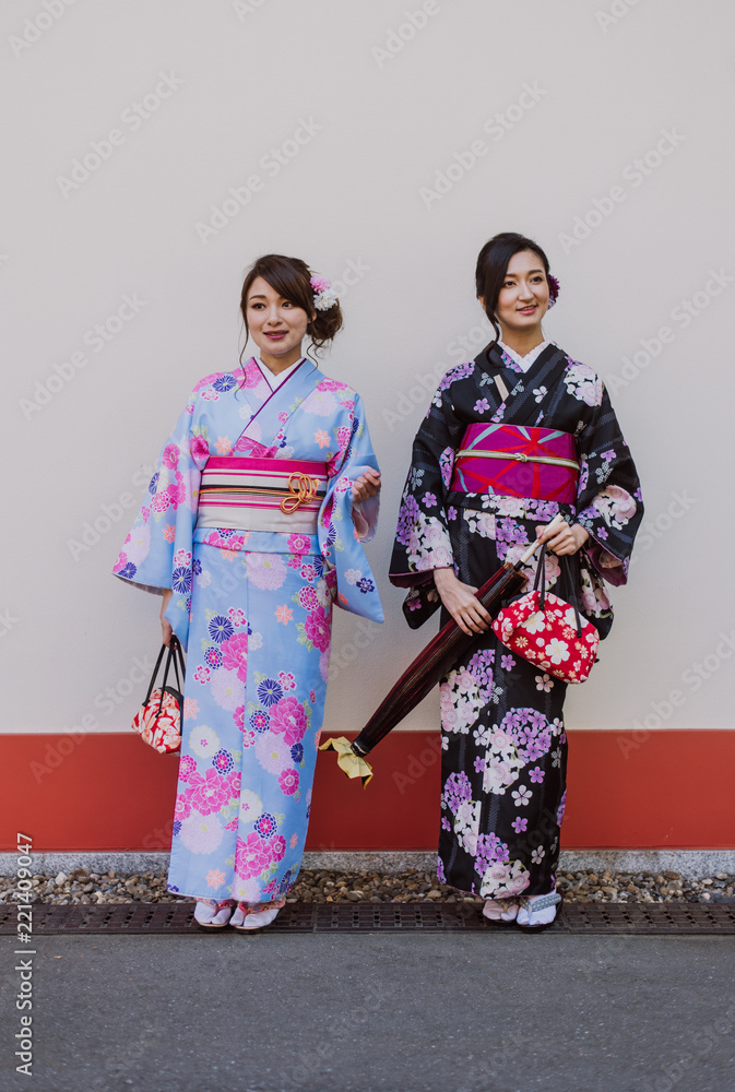 Two japanese girls wearing kimonos traditional clothes, lifestyle moments Two japanese girls wearing kimonos traditional clothes, lifestyle moments